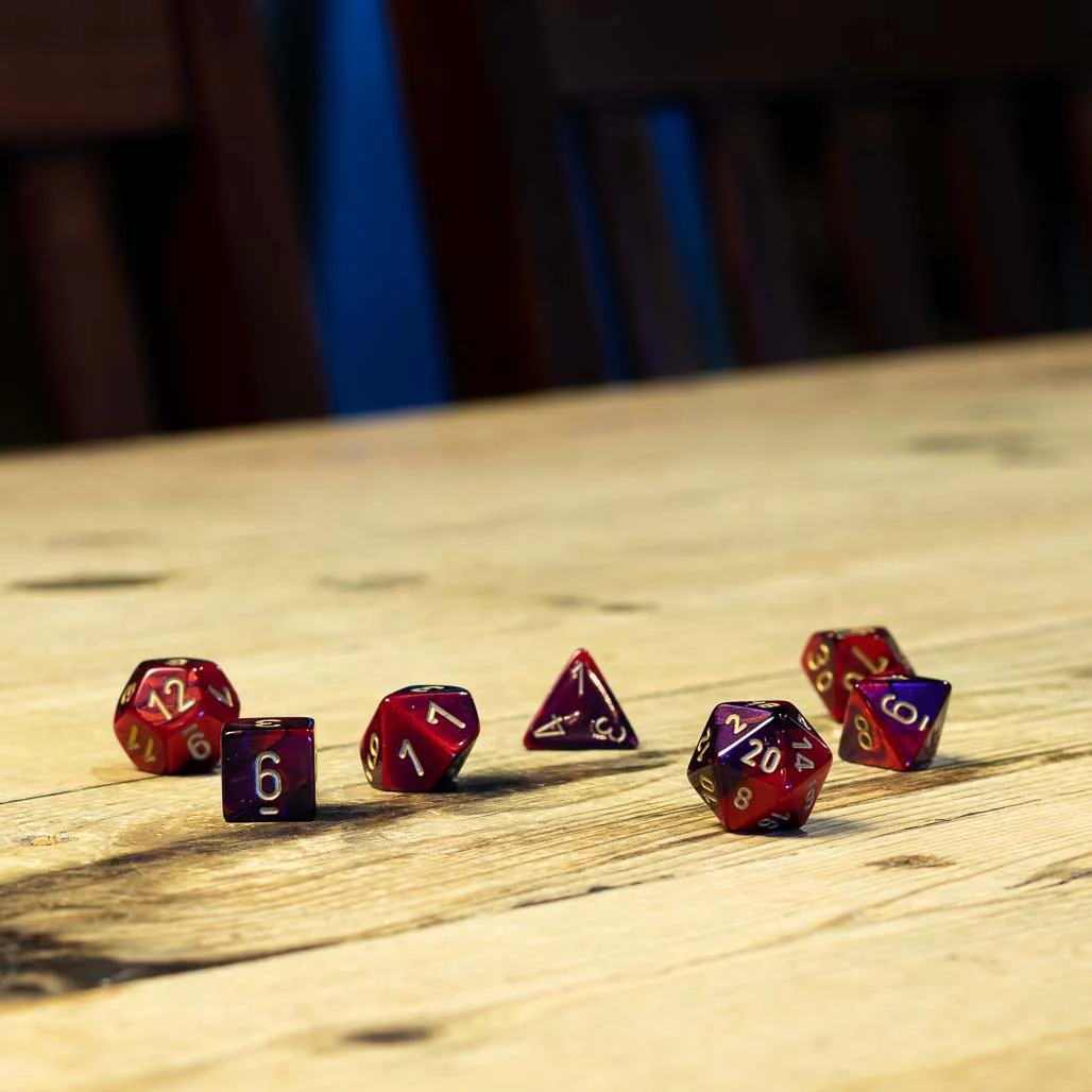 Chessex #26426 - Gemini Purple-Red / Gold Polyhedral (7ct)
